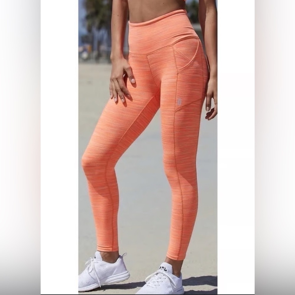Free People Movement Roll Out Legging in Neon Mango Color